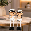 Polyresin Family Theme Hat Wearing Couple Showpiece