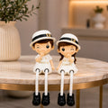 Polyresin Family Theme Hat Wearing Couple Showpiece